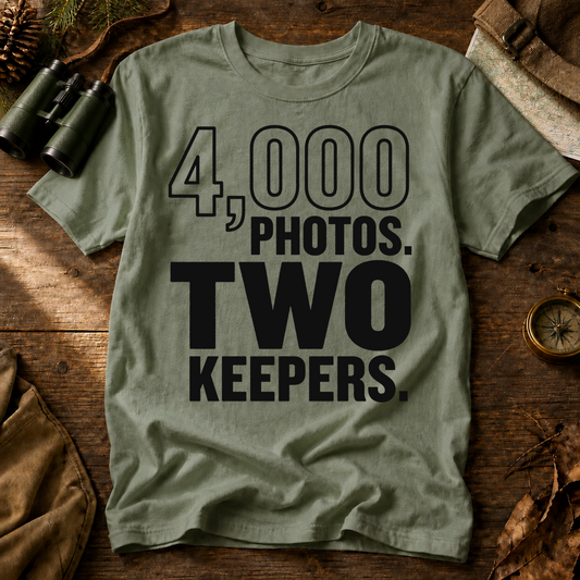 4,000 Photos Two Keepers Bird Photography Tee in Bay, centered front design on a birdwatching flat-lay mockup