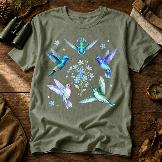 Hummingbird Floral Circle Tee in Bay, centered front design on a birdwatching flat-lay mockup