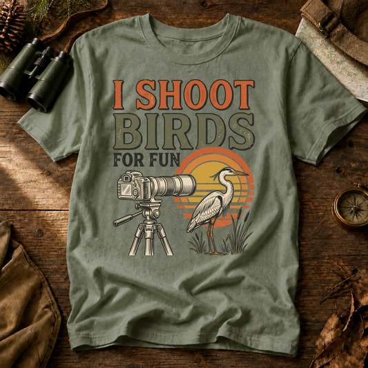 I Shoot Birds for Fun Photography Tee in Bay, centered front design on a birdwatching flat-lay mockup