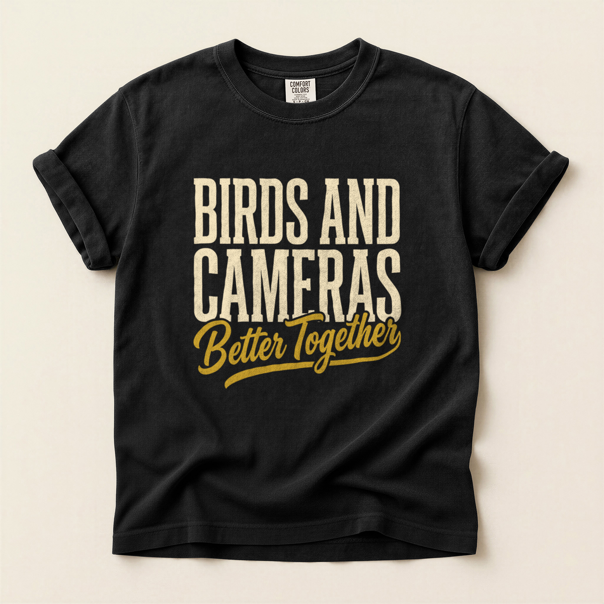 Birds Cameras Together T-Shirt in Bay laid beside field gear
