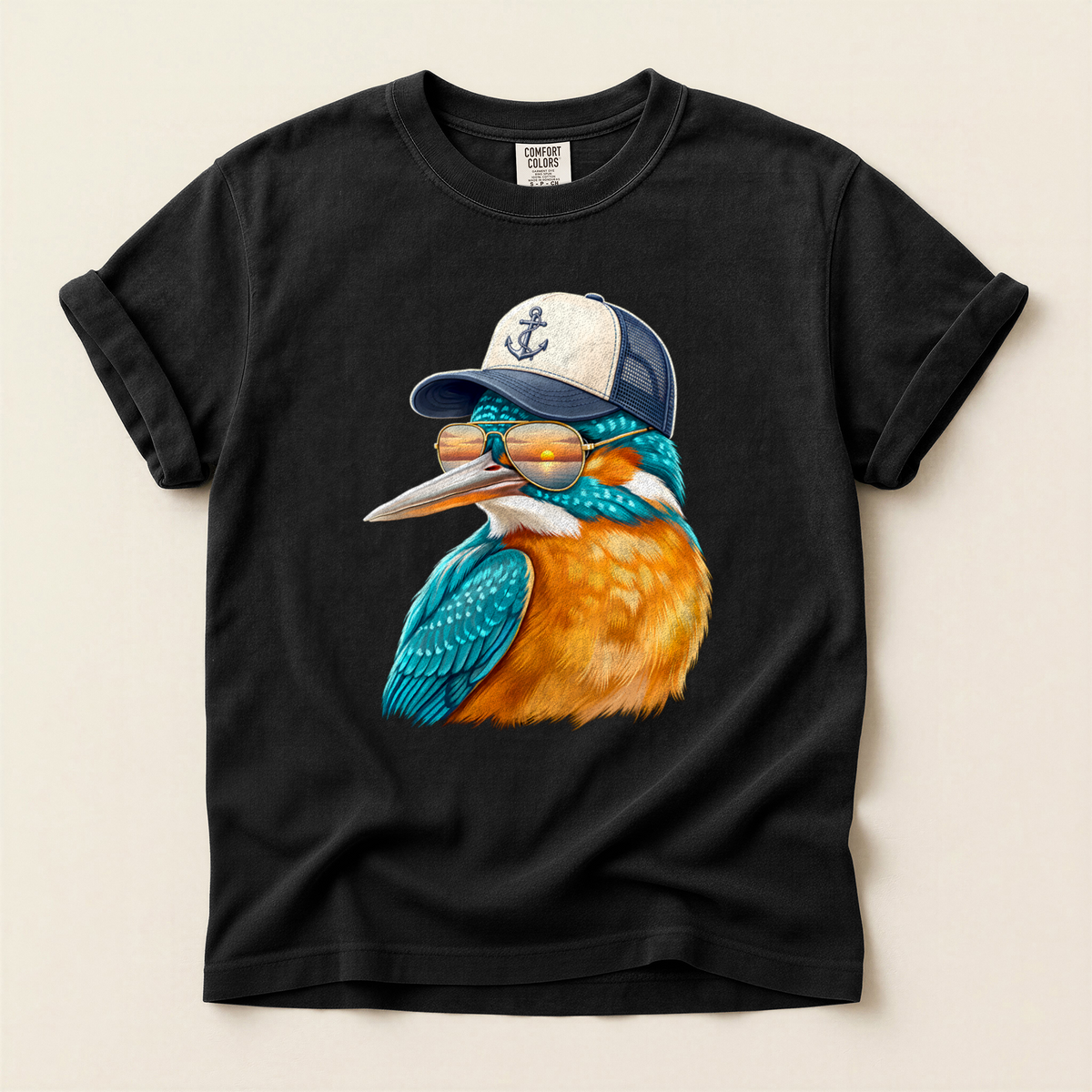 Kingfisher Trucker Cap T-Shirt in Bay laid beside field gear