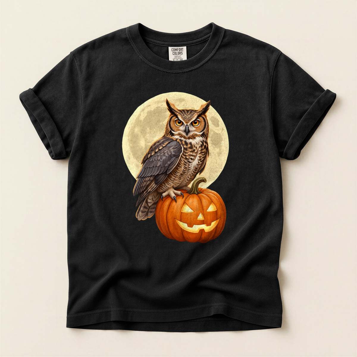 Owl Pumpkin Moon T-Shirt in Bay laid beside field gear