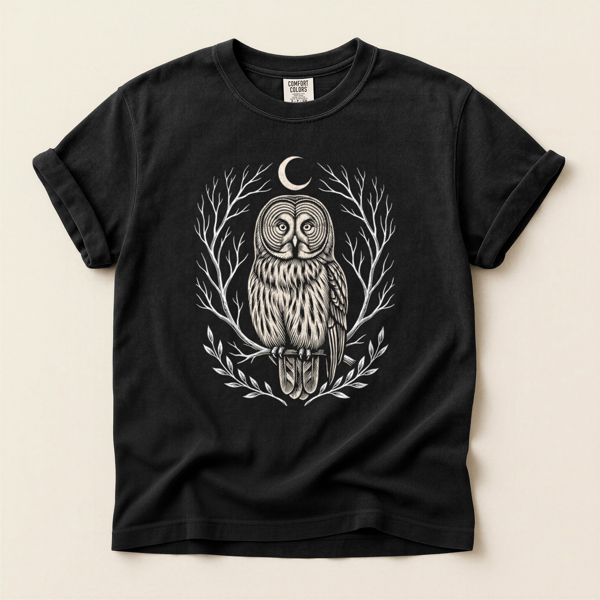 Moon Owl Wreath T-Shirt in Bay laid beside field gear