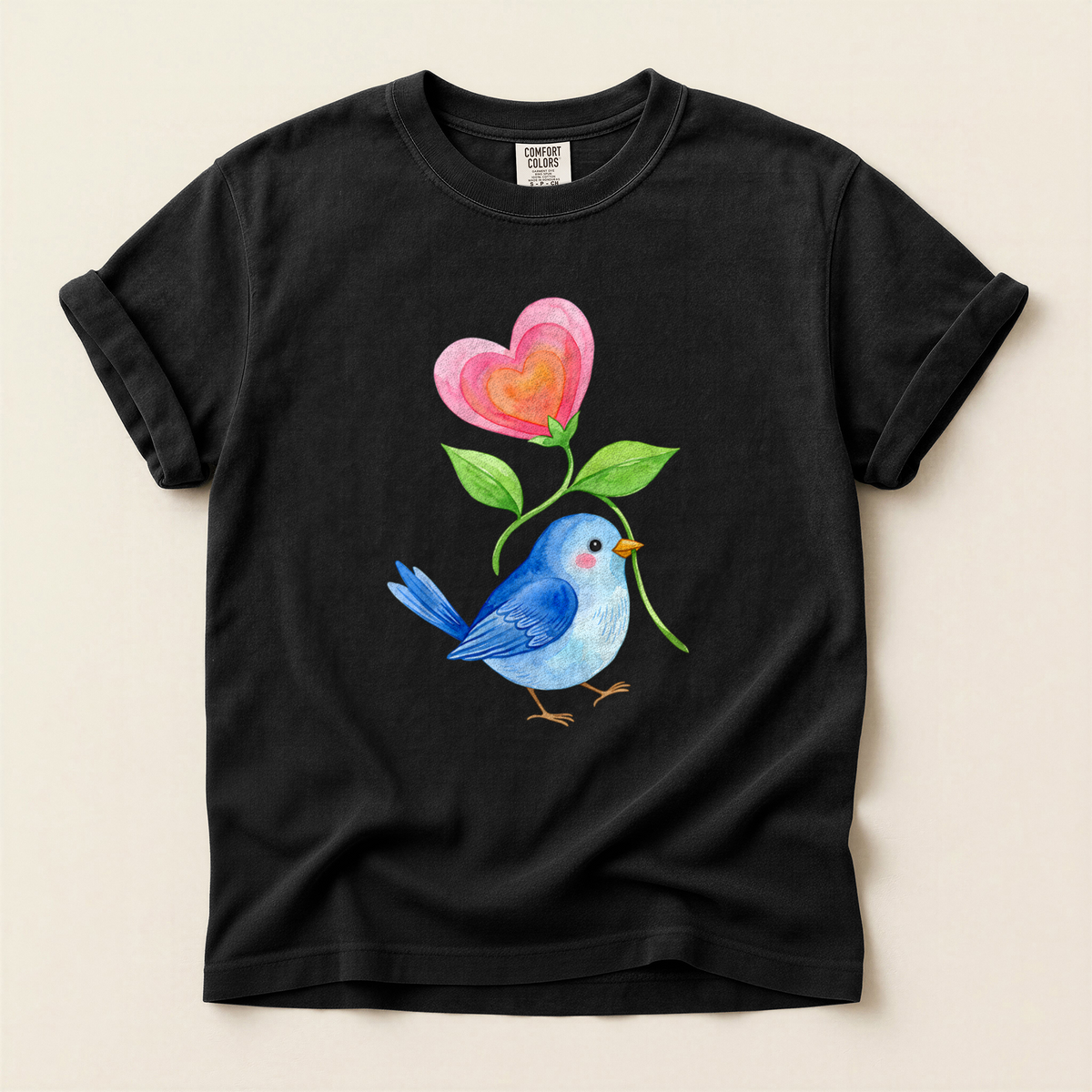 Bluebird Heart Flower T-Shirt in Bay laid beside field gear