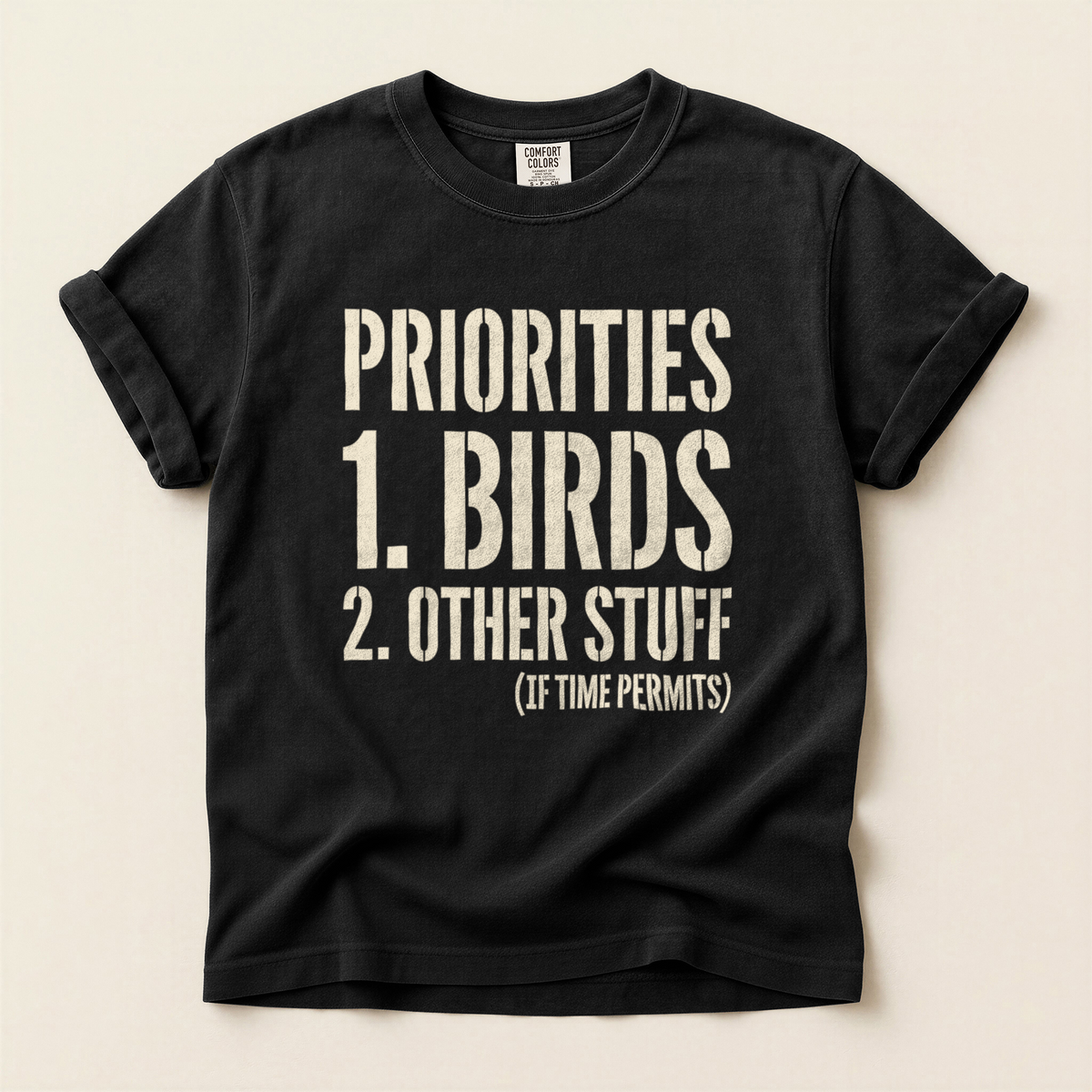 Priorities Birds First T-Shirt in Bay laid beside field gear