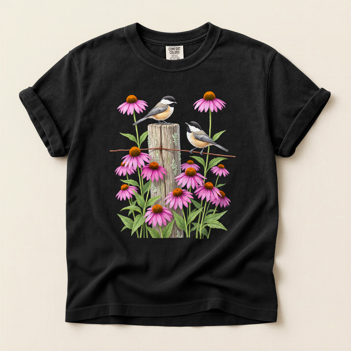 Chickadees And Coneflowers T-Shirt in Bay laid beside field gear