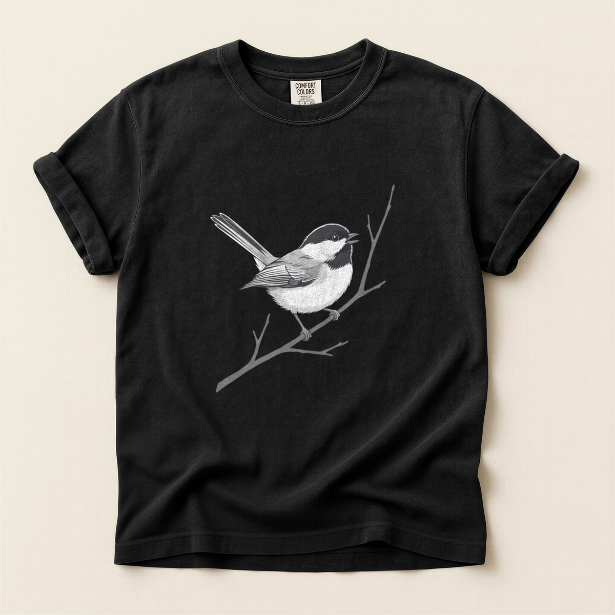 Chickadee Bare Branch T-Shirt in Bay laid beside field gear
