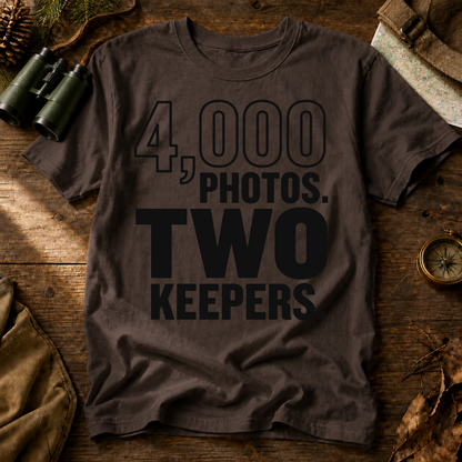 4,000 Photos Two Keepers Bird Photography Tee in Espresso, centered front design on a birdwatching flat-lay mockup