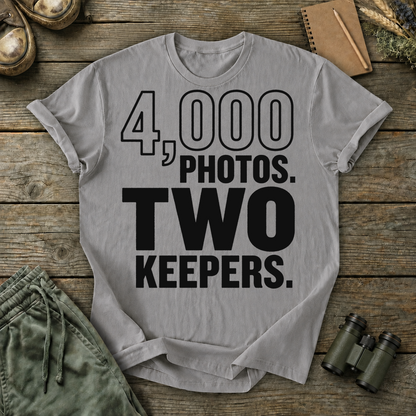 4,000 Photos Two Keepers Bird Photography Tee in Grey, centered front design on a birdwatching flat-lay mockup