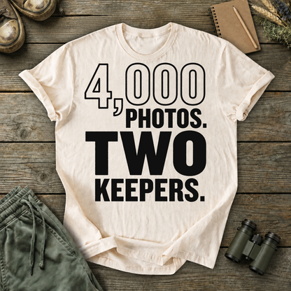 4,000 Photos Two Keepers Bird Photography Tee in Ivory, centered front design on a birdwatching flat-lay mockup