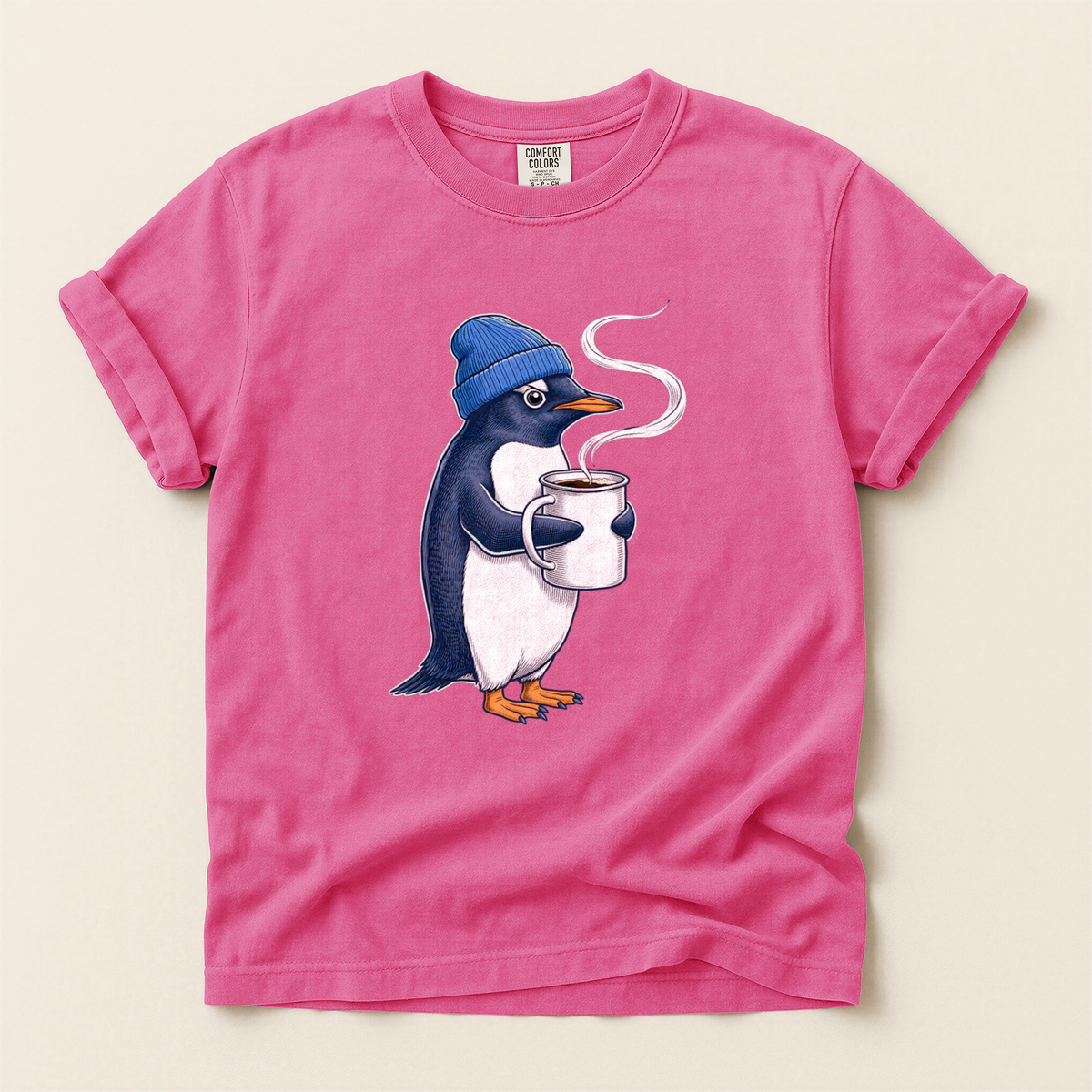 Penguin Coffee Mug T-Shirt in Bay laid beside field gear