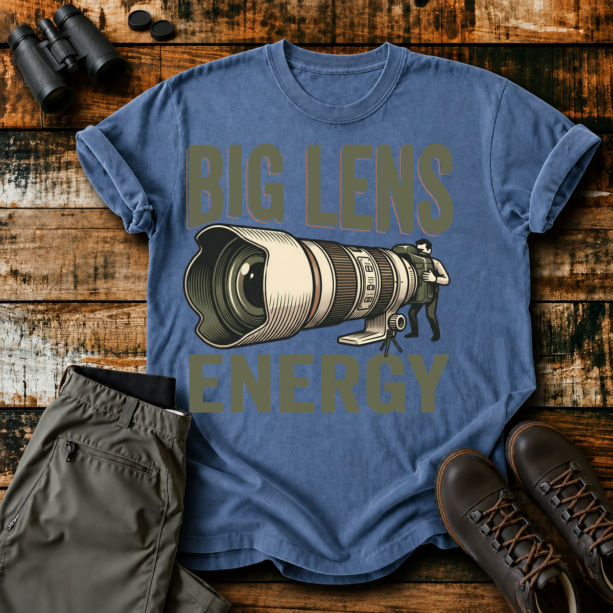 Big Lens Energy Bird Photography Tee in Blue Jean, centered front design on a birdwatching flat-lay mockup