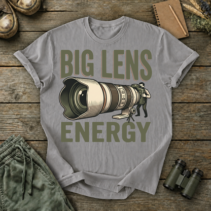 Big Lens Energy Bird Photography Tee in Grey, centered front design on a birdwatching flat-lay mockup