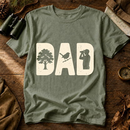 Bird Dad Silhouette Tee in Bay, centered front design on a birdwatching flat-lay mockup