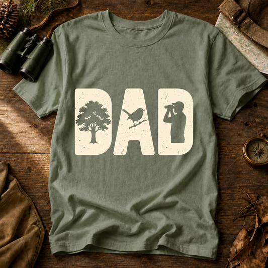 Bird Dad Silhouette Tee in Bay, centered front design on a birdwatching flat-lay mockup