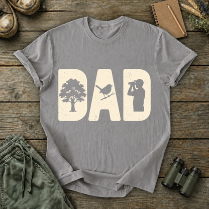 Bird Dad Silhouette Tee in Grey, centered front design on a birdwatching flat-lay mockup