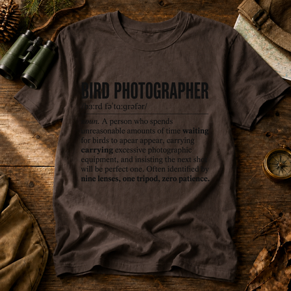 Bird Photographer Definition Tee in Espresso, centered front design on a birdwatching flat-lay mockup