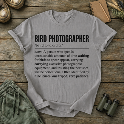 Bird Photographer Definition Tee in Grey, centered front design on a birdwatching flat-lay mockup