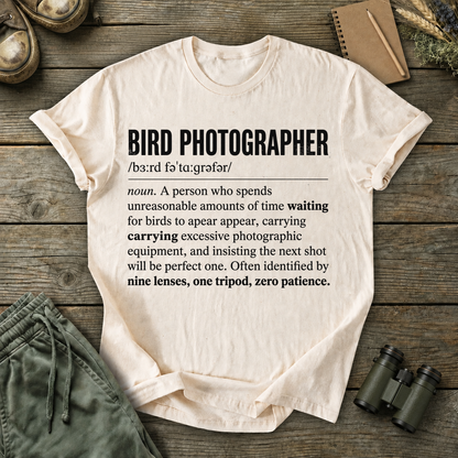 Bird Photographer Definition Tee in Ivory, centered front design on a birdwatching flat-lay mockup