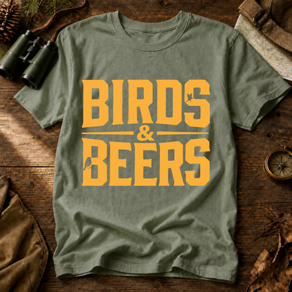 Birds & Beers Tee in Bay, centered front design on a birdwatching flat-lay mockup