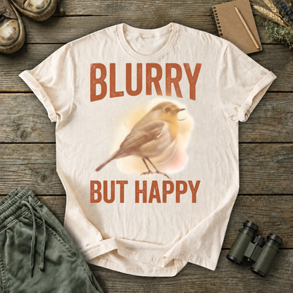 Blurry but Happy Bird Photography Tee in Ivory, centered front design on a birdwatching flat-lay mockup