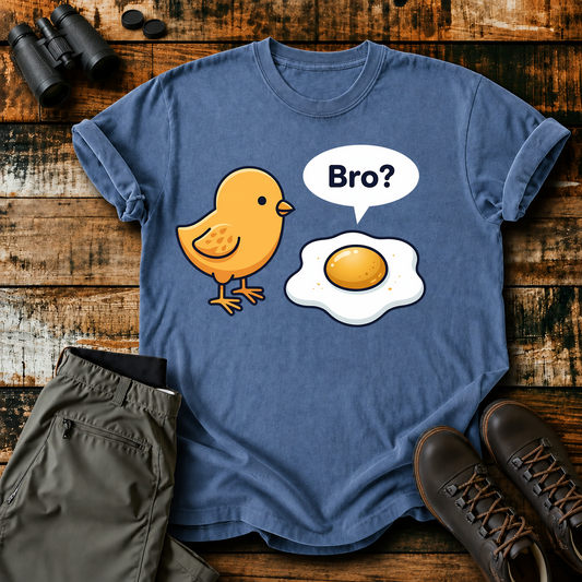 Bro Chick and Egg Tee in Blue Jean, centered front design on a birdwatching flat-lay mockup