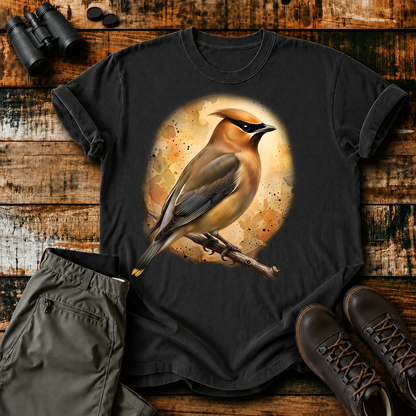 Cedar Waxwing Watercolor Portrait Tee in Black, centered front design on a birdwatching flat-lay mockup