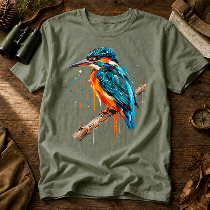 Common Kingfisher Watercolor Tee in Bay, centered front design on a birdwatching flat-lay mockup