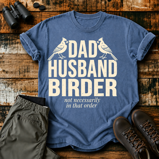 Dad Husband Birder Tee in Blue Jean, centered front design on a birdwatching flat-lay mockup