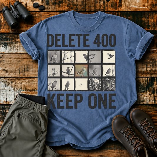 Delete 400 Keep One Bird Photography Tee in Blue Jean, centered front design on a birdwatching flat-lay mockup