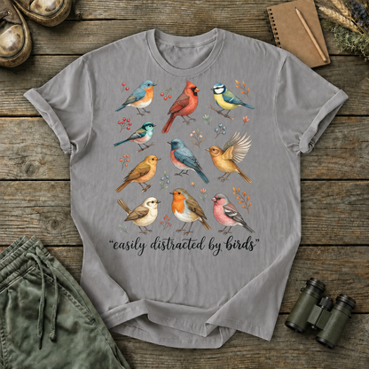 Easily Distracted by Birds Colorful Flock Tee in Grey, centered front design on a birdwatching flat-lay mockup
