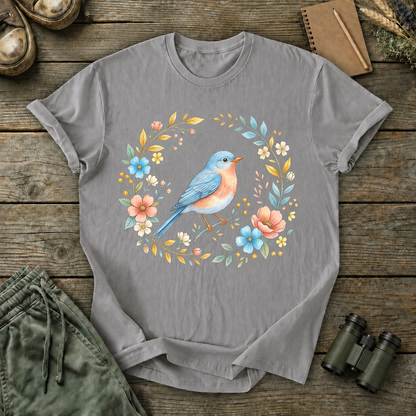 Eastern Bluebird Floral Wreath Tee in Grey, centered front design on a birdwatching flat-lay mockup