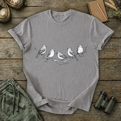 Five Birds on a Branch Tee in Grey, centered front design on a birdwatching flat-lay mockup