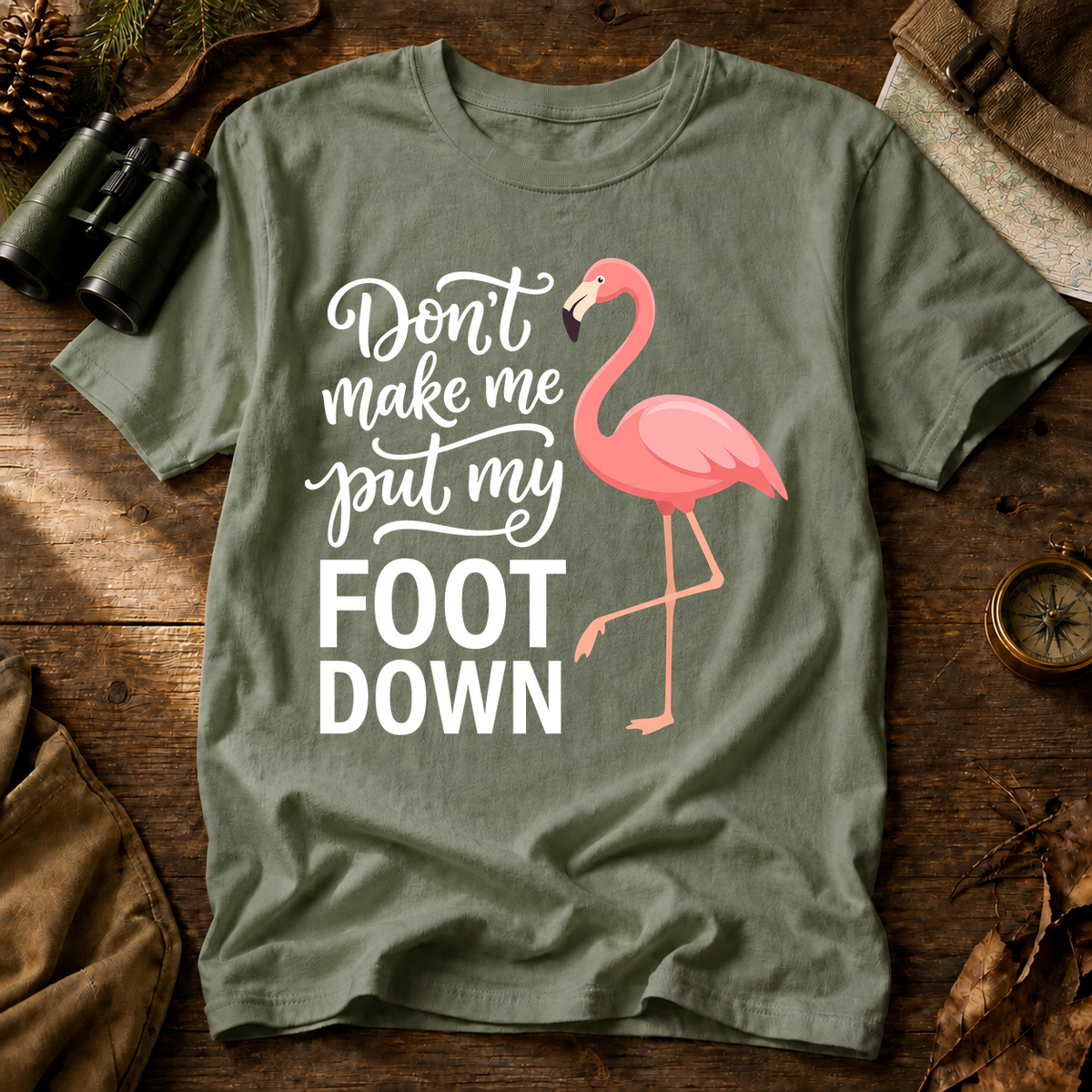 Flamingo Foot Down Tee in Bay laid beside field gear