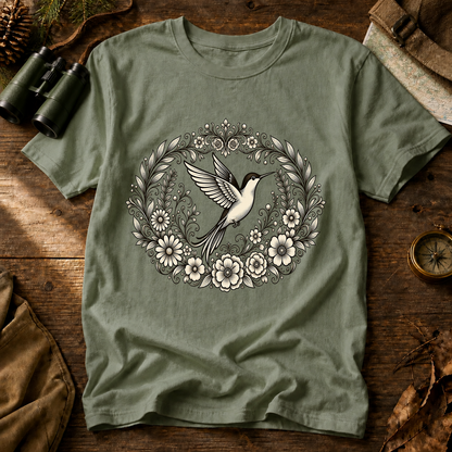 Floral Hummingbird Wreath Tee in Bay, centered front design on a birdwatching flat-lay mockup