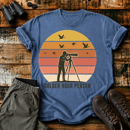 Golden Hour Bird Photographer Tee in Blue Jean, centered front design on a birdwatching flat-lay mockup