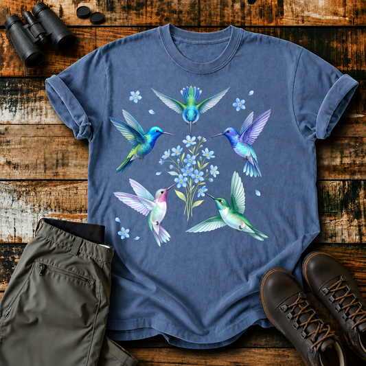 Hummingbird Floral Circle Tee in Blue Jean, centered front design on a birdwatching flat-lay mockup