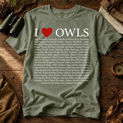 I Love Owls Bird List Tee in Bay, centered front design on a birdwatching flat-lay mockup