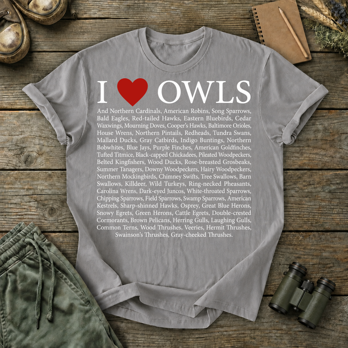 I Love Owls Bird List Tee in Grey, centered front design on a birdwatching flat-lay mockup