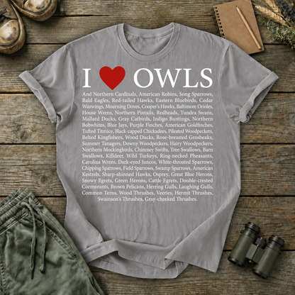 I Love Owls Bird List Tee in Grey, centered front design on a birdwatching flat-lay mockup