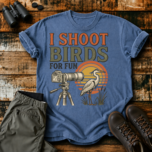 I Shoot Birds for Fun Photography Tee in Blue Jean, centered front design on a birdwatching flat-lay mockup