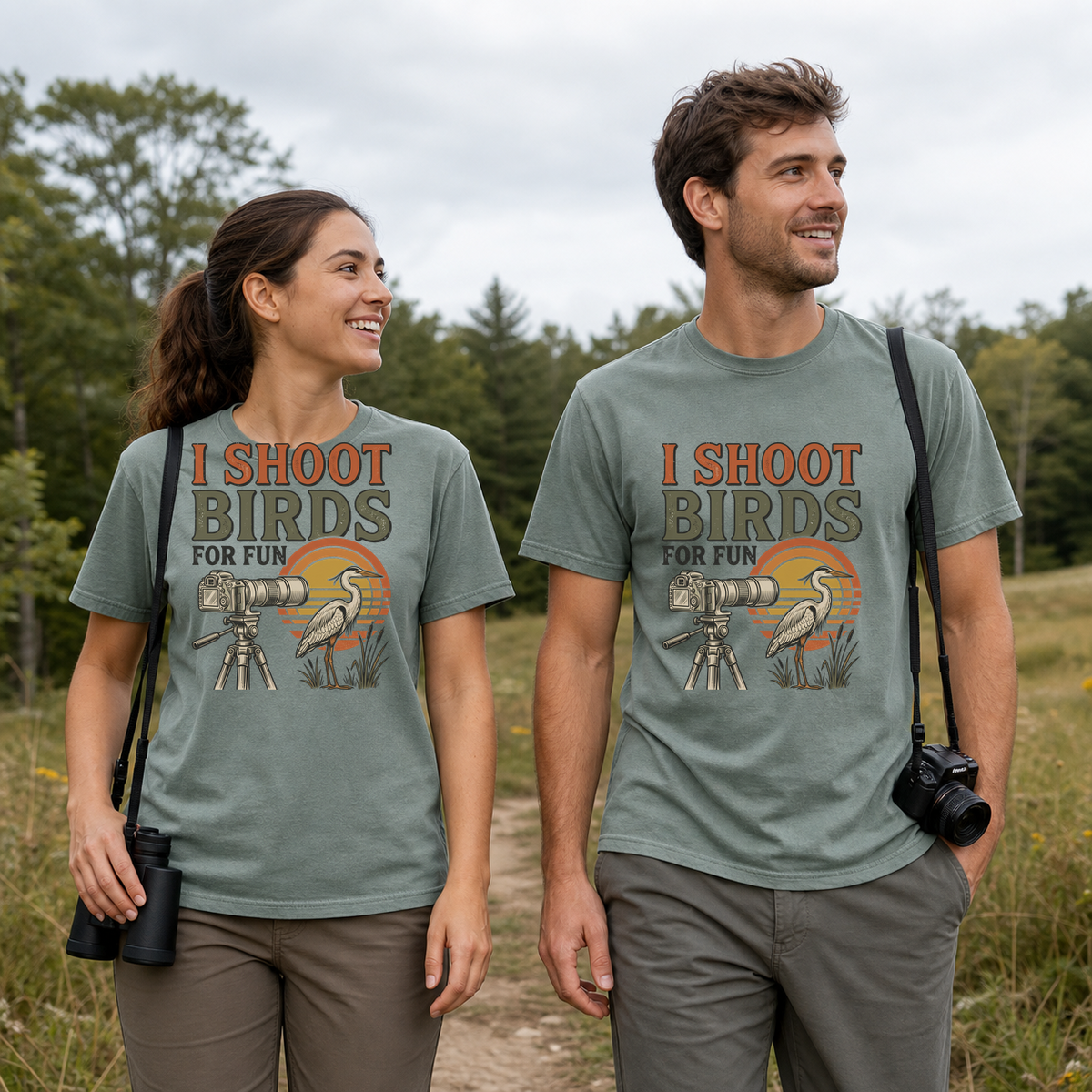 Female and male models wearing the I Shoot Birds for Fun Photography Tee in Bay, with the artwork centered on both shirts