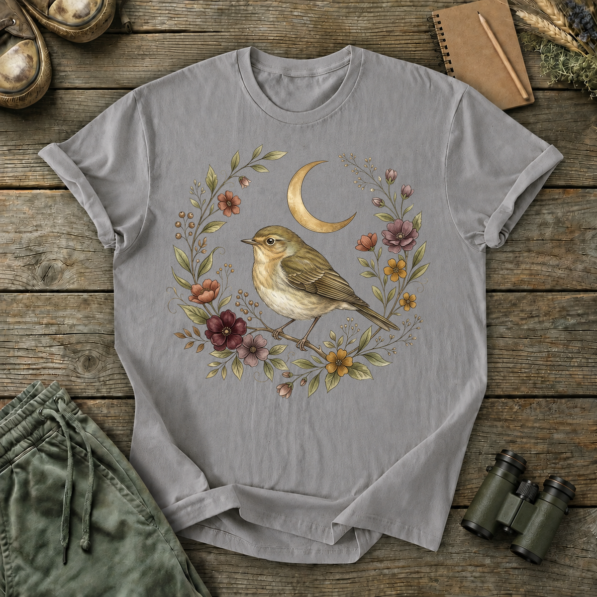 Moonlit Songbird Floral Wreath Tee in Grey, centered front design on a birdwatching flat-lay mockup