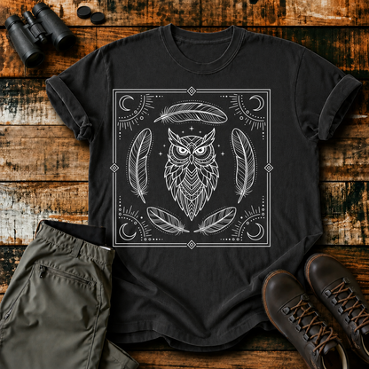 Mystical Owl and Feathers Line Art Tee in Black, centered front design on a birdwatching flat-lay mockup