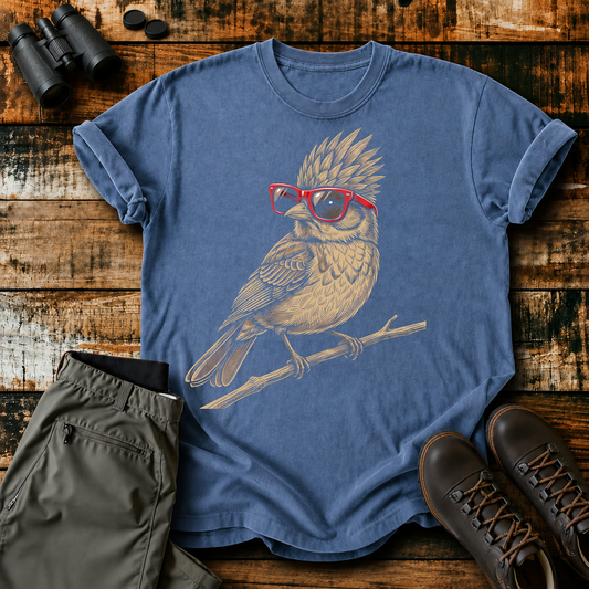 Nerdy Owl Red Glasses Tee in Blue Jean, centered front design on a birdwatching flat-lay mockup