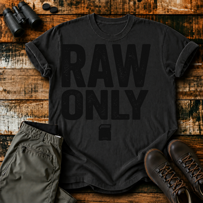 RAW Only Bird Photography Tee in Black, centered front design on a birdwatching flat-lay mockup
