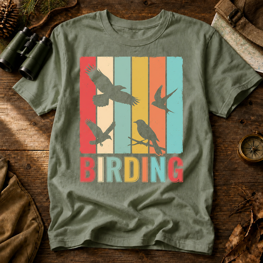 Retro Birding Silhouette Stripes Tee in Bay, centered front design on a birdwatching flat-lay mockup