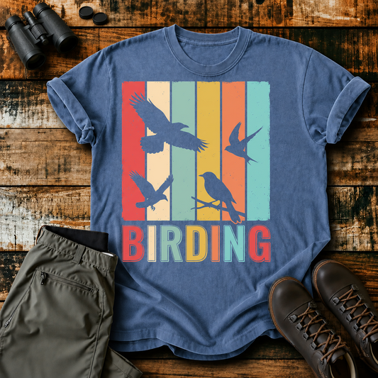 Retro Birding Silhouette Stripes Tee in Blue Jean, centered front design on a birdwatching flat-lay mockup