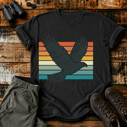 Retro Flying Bird Stripes Tee in Black, centered front design on a birdwatching flat-lay mockup