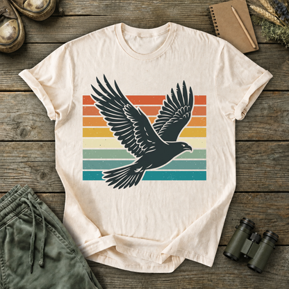 Retro Flying Bird Stripes Tee in Ivory, centered front design on a birdwatching flat-lay mockup